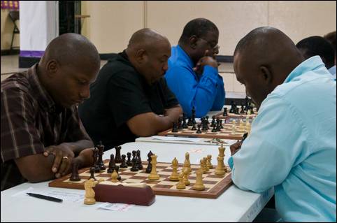 Ken Gibson (left) facing Chappel Whyms in the final round of the Bahamas National Championship. Gibson would win the encounter to earn the title. Photo by Bahamas Chess Federation.